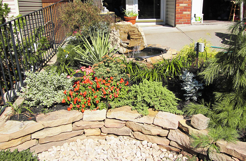 A garden wall by Russo's landscape